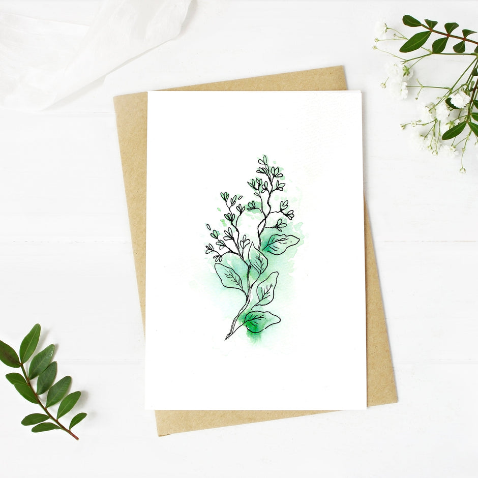 Greeting card with green leaf design on a white background