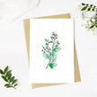 Greeting card with green leaf design on a white background