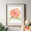 Framed floral artwork on a wall with decorative items below
