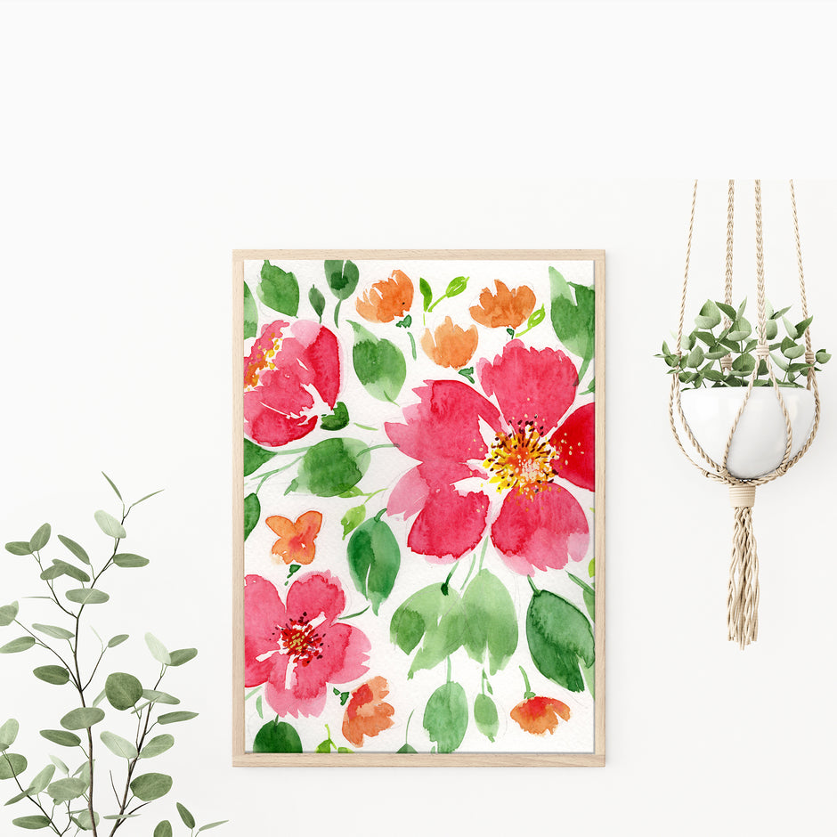 Floral painting with pink and orange flowers on a white wall, with a plant and pot in the background.