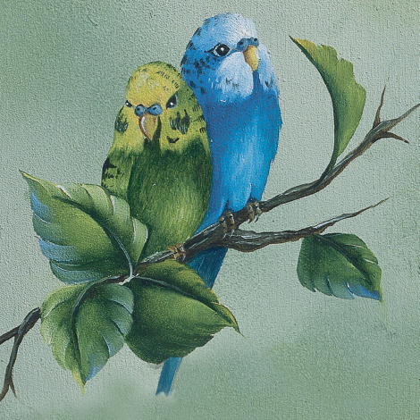 Two parakeets on a branch with leaves against a light green background