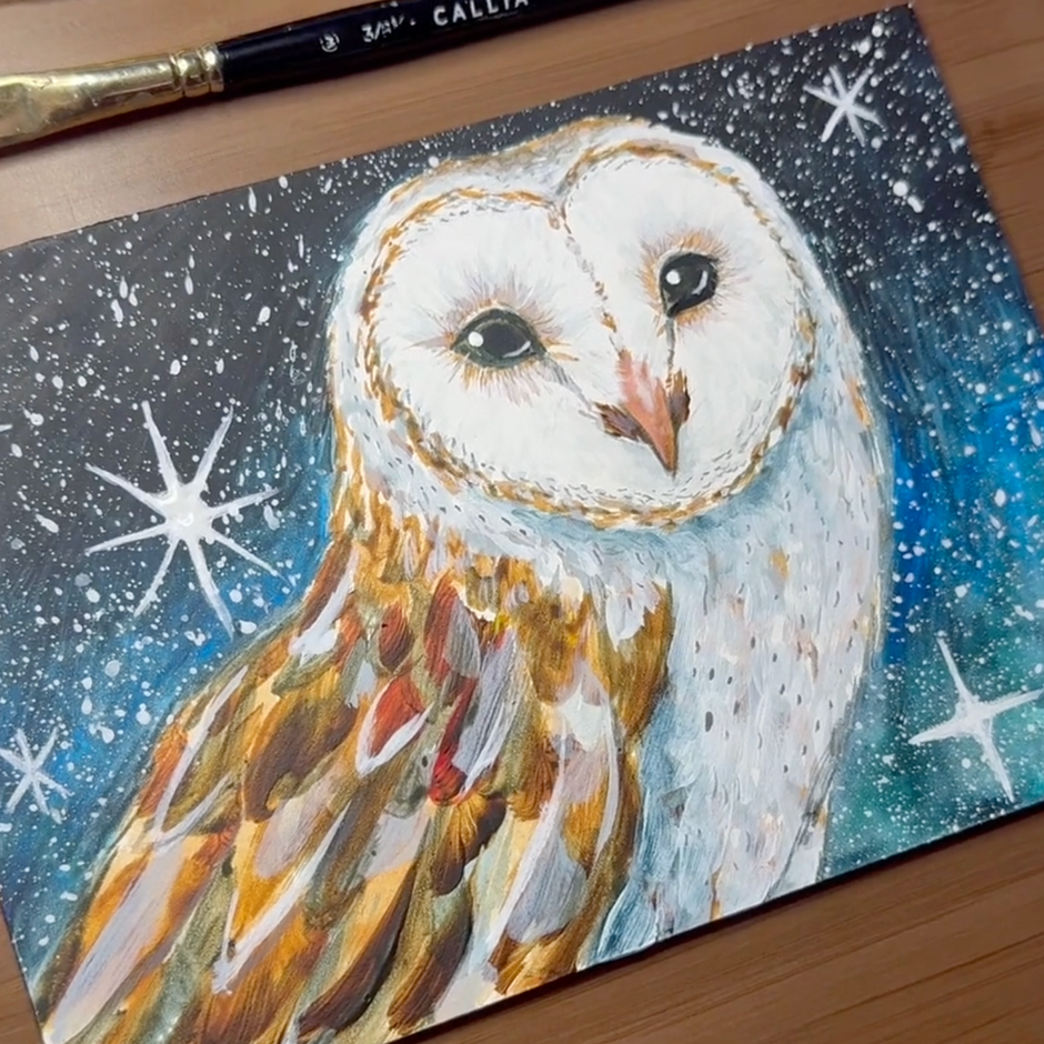 Painting of an owl on a starry night background with a paintbrush next to it.