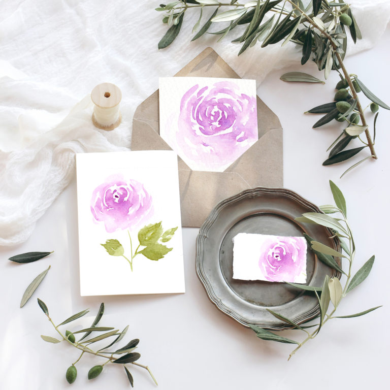 Summer wedding stationery mock-up scene. Blank greeting cards, envelope, vintage silver plate, olive branches and ribbon. White background with cotton table runner in sunlight, flat lay, top view.